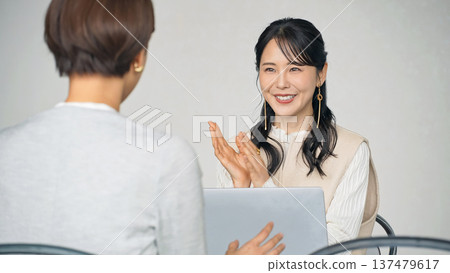 A group of women meeting in the lobby A group of women meeting in the lobby 137479617