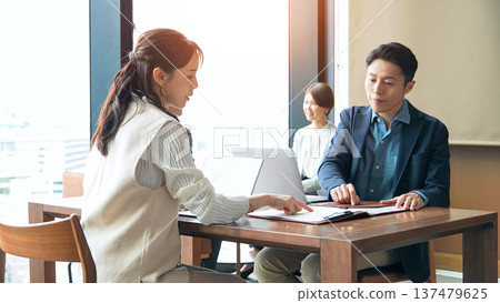 A group of casual business people meeting in a lobby 137479625