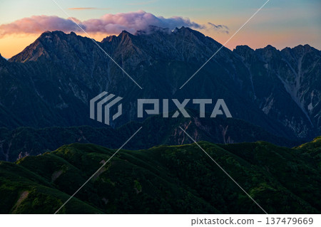 The Hotaka mountain range at dawn as seen from Mount Sugoroku in the Northern Alps The Hotaka mountain range at dawn as seen from Mount Sugoroku in the Northern Alps 137479669