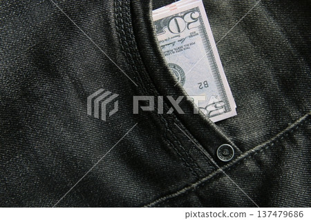 American dollars USD banknotes in jeans pocket. American dollars USD banknotes in jeans pocket. 137479686