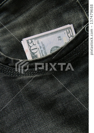 American dollars USD banknotes in jeans pocket. American dollars USD banknotes in jeans pocket. 137479688