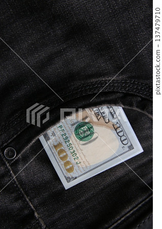 American dollars USD banknotes in jeans pocket. American dollars USD banknotes in jeans pocket. 137479710