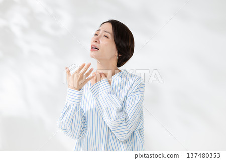 A woman who is not feeling well 137480353