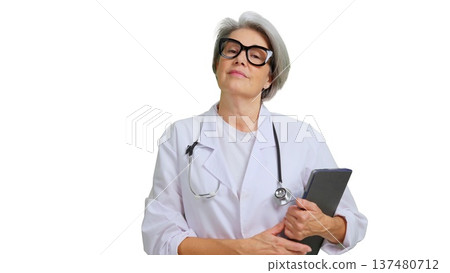 Mature female doctor holding digital tablet and stethoscope 137480712