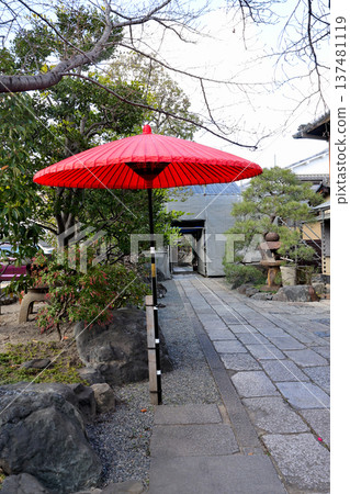 Stone path and red outdoor tea ceremony hats leading to the Yagi residence, former site of Mibu Garrison, birthplace of the Shinsengumi Stone path and red outdoor tea ceremony hats leading to the Yagi residence, former site of Mibu Garrison, birthplace of the Shinsengumi 137481119