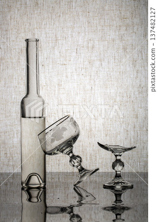 Still life with glassware and a broken glass 137482127