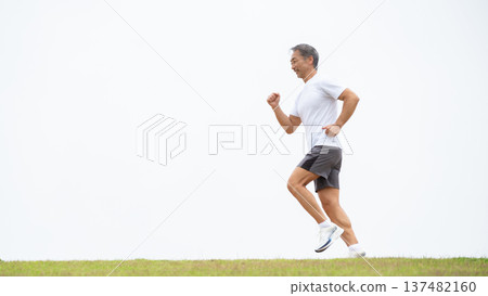 Man running along the bank Man running along the bank 137482160