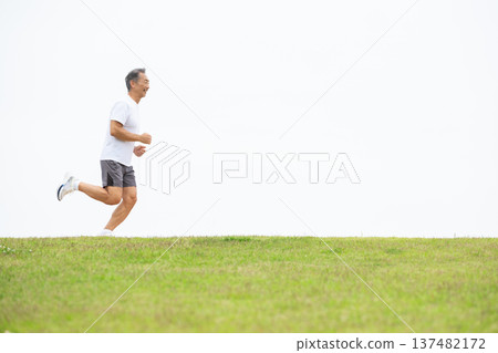 Man running along the bank 137482172
