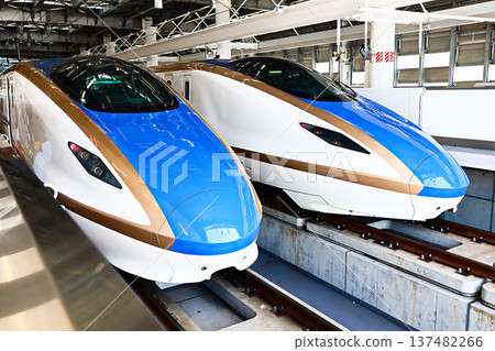 Hokuriku Shinkansen W7 series train stopping at Tsuruga Station Hokuriku Shinkansen W7 series train stopping at Tsuruga Station 137482266