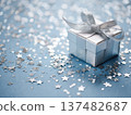 Silver gift box on blue surface with scattered stars 137482687