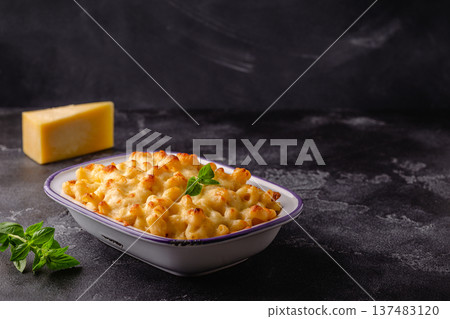 American mac and cheese, macaroni pasta in cheesy sauce 137483120