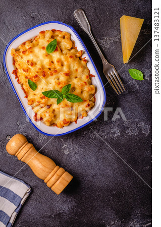 American mac and cheese, macaroni pasta in cheesy sauce 137483121