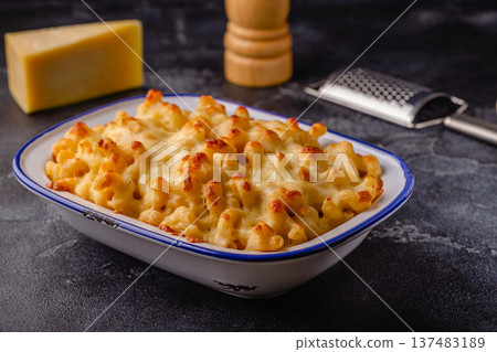 American mac and cheese, macaroni pasta in cheesy sauce 137483189