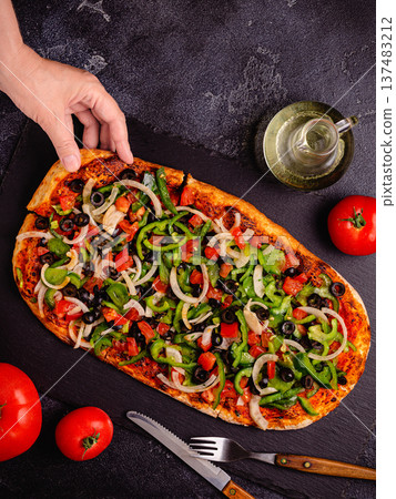 Homemade vegan pizza with tomatoes, peppers, olives, onions and herbs. Homemade vegan pizza with tomatoes, peppers, olives, onions and herbs. 137483212
