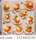 Cooked scallops with sauce 137483239