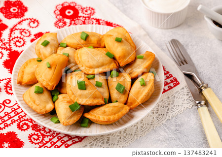 Dumplings, filled with mashed potatoes. 137483241