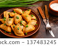 Dumplings, filled with mashed potatoes. 137483245