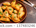 Dumplings, filled with mashed potatoes. 137483246