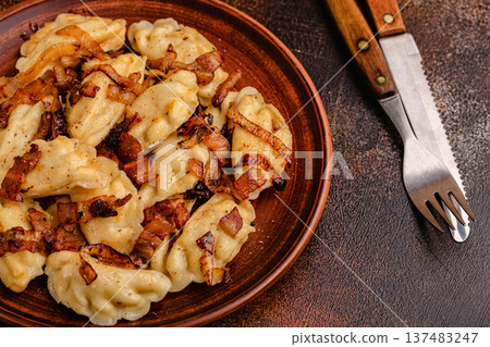 Dumplings, filled with mashed potatoes. 137483247