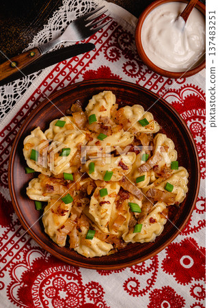 Dumplings, filled with mashed potatoes. 137483251