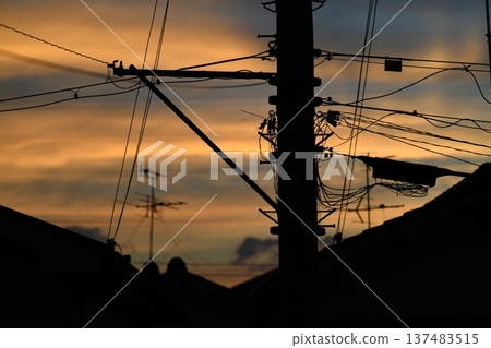 Late summer sunset and power lines Late summer sunset and power lines 137483515