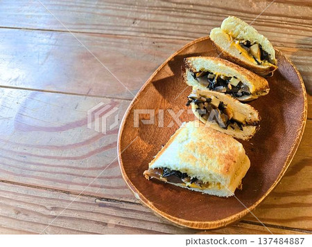Hot cheese sandwiches arranged on a wooden plate Hot cheese sandwiches arranged on a wooden plate 137484887