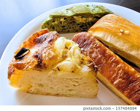 Lots of bread on a white plate Lots of bread on a white plate 137484894