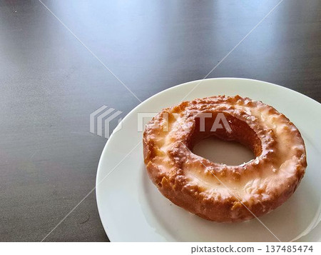 Sugar donut on a white plate Sugar donut on a white plate 137485474