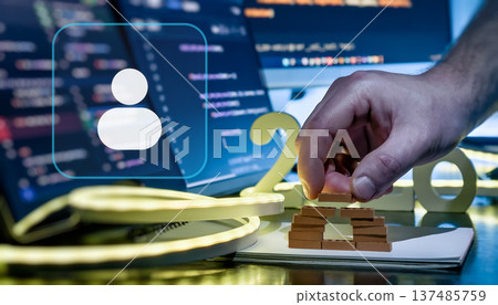 AI User Profile and Cloud Setup Concept with 2026 Desk Scene, Coding Screens and Hand Building Digital Structure AI User Profile and Cloud Setup Concept with 2026 Desk Scene, Coding Screens and Hand Building Digital Structure 137485759