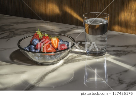 Fresh Mixed Berries in Bowl with Strawberries and Blueberries Next to Glass of Water Fresh Mixed Berries in Bowl with Strawberries and Blueberries Next to Glass of Water 137486176