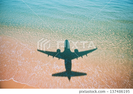 Airplane Shadow Over Sand and Water at Exotic Travel Destination Concept Airplane Shadow Over Sand and Water at Exotic Travel Destination Concept 137486195