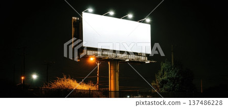 Minimal Artistic Shot of Empty Billboard Floating in Dark Urban Night Scene 137486228