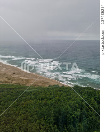 It is a foggy seascape. 137486254