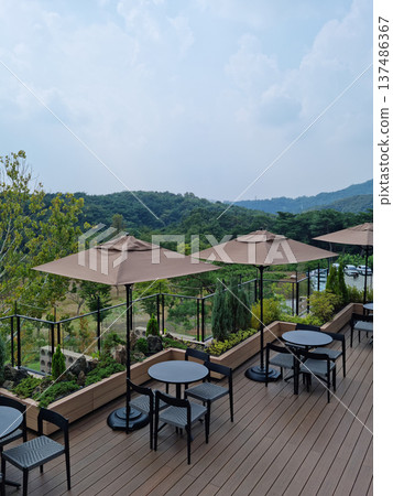 It is an outdoor terrace cafe. It is an outdoor terrace cafe. 137486367