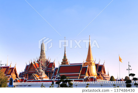 Wat Pho (Temple of the Reclining Buddha, Wat Phra Chetuphon) complex, sightseeing landmark of Bangkok, Thailand. Wat Pho on sunset sky background. Topic of vacation, travel, trip, cruises, tour 137486430