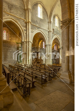 Avallon church interior showing ancient arches and wooden pews 137486531