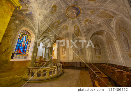 Historic French chapel interior featuring stained glass and frescoes Historic French chapel interior featuring stained glass and frescoes 137486532