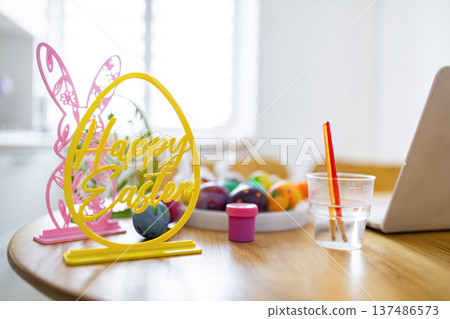 A bright and cheerful scene depicting the preparation for Easter egg decorating with colorful eggs and festive decorations 137486573