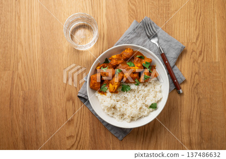 Chicken tikka masala curry with rice on wooden background 137486632