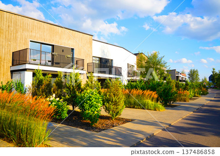 Modern Residential Area With Lush Landscaping at townhouse. Residential neighborhood  137486858
