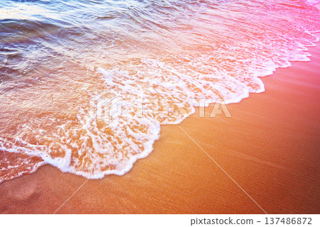 Waves at sea on dramatic sunset background. Sea waves at beach. Waves on sea Waves at sea on dramatic sunset background. Sea waves at beach. Waves on sea 137486872