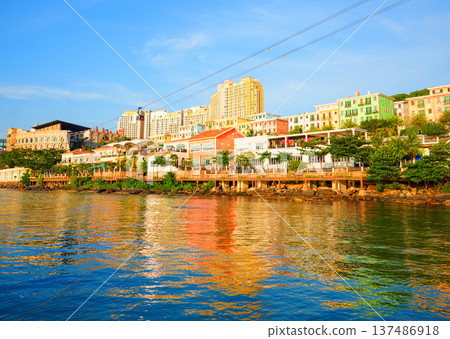 Cable car in tourist area. Coastal views of colorful buildings at waterfront in n Phu Quoc Island, Cable car in tourist area. Coastal views of colorful buildings at waterfront in n Phu Quoc Island, 137486918
