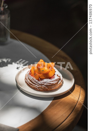 Peach danish pastry with powdered sugar Peach danish pastry with powdered sugar 137486970