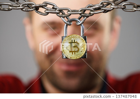 Man being tied up in block chain 137487048