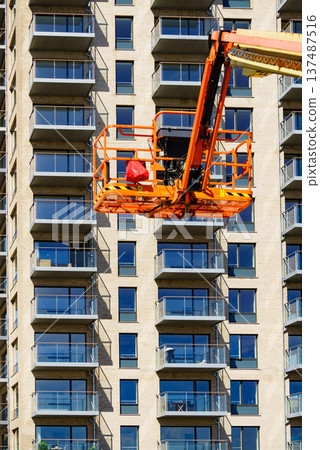 Basket lift on construction site Basket lift on construction site 137487516