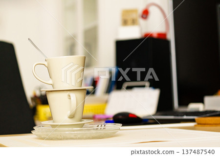 Dirty cups after coffee drinking, messy desk Dirty cups after coffee drinking, messy desk 137487540
