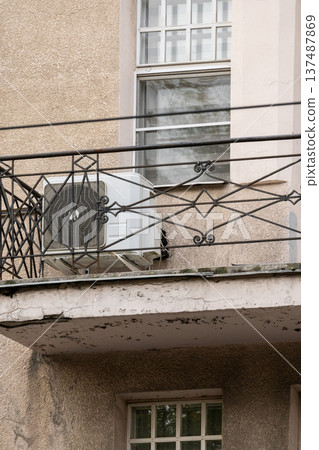 air conditioning on facade of building, air cooling in hot weather. air conditioning on facade of building, air cooling in hot weather. 137487869