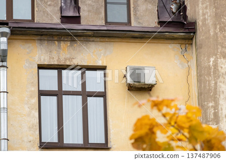 air conditioning on facade of building, air cooling in hot weather. air conditioning on facade of building, air cooling in hot weather. 137487906