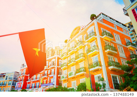 Colorful facade buildings with Vietnamese flag in urban on sunset. Colorful facade buildings with Vietnamese flag in urban on sunset. 137488149