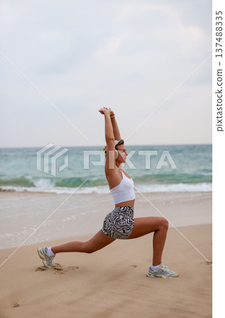 Female Performing Mobility Exercise Outdoors. Woman Engaged In Balance And Strength Training Outdoors Female Performing Mobility Exercise Outdoors. Woman Engaged In Balance And Strength Training Outdoors 137488335